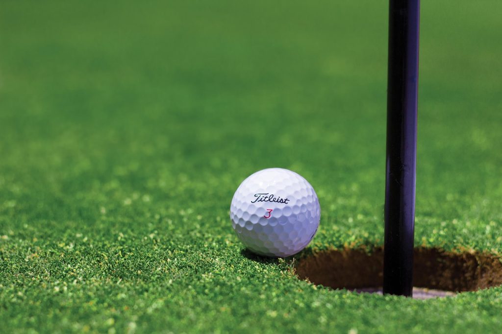 golf, golf ball, hole, golf course, field, grass, sport, ground, ball, green, game, competition, outdoors, golfer, nature, tournament, hobby, play, practice, golfing, golf field, flag stick